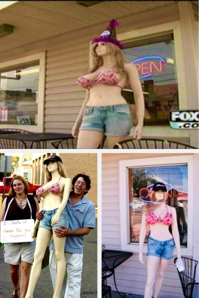 Three life-size mannequins in pink bikinis and denim shorts displayed outside storefronts, with people posing nearby.