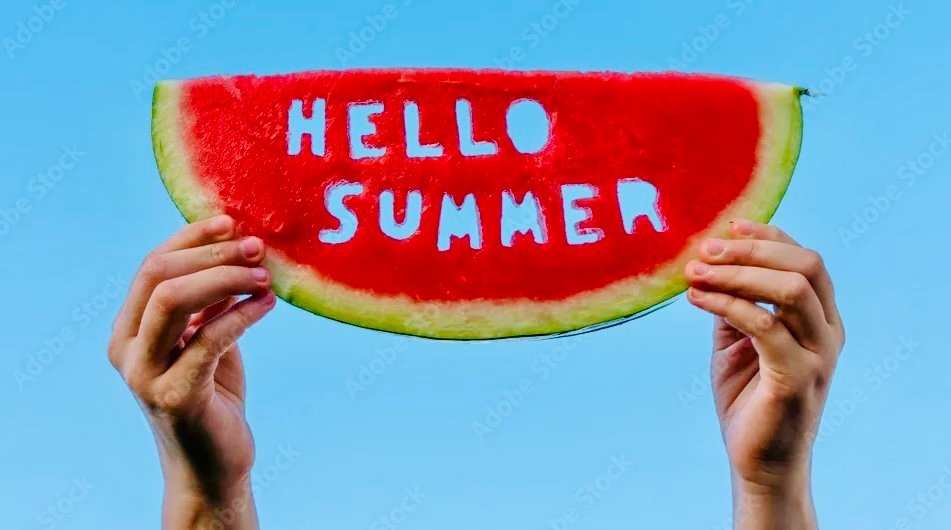 image001 - BBQ News Hands hold a watermelon slice with 'HELLO SUMMER' painted on against a clear blue sky, conveying a summer vibe.